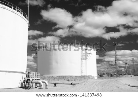 Oil industry and gas industry. Work of refinery petrochemical plant. Oil reservoir and storage tank of mineral oil