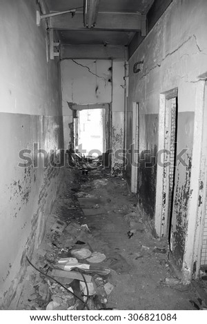 Inside of destroyed house. Ruins of home. Black and white photo