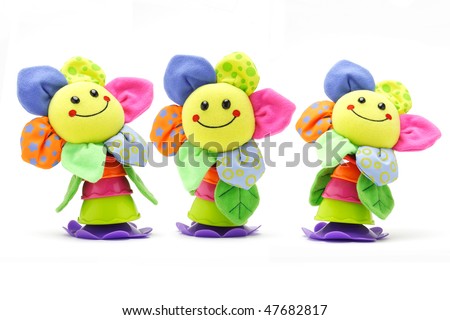 stock photo Three sunflower smiley face dolls on white background