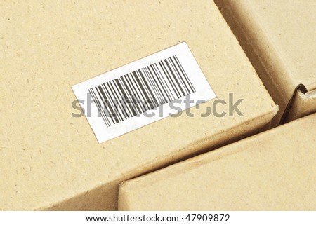 Close up of bar code label on carton box (bar code randomly created)