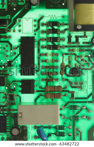 Abstract back lit green electronic circuit board background