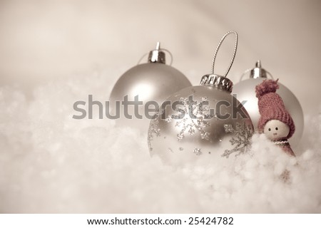 Set of Christmas balls and an elf on fake snow with antique colors.