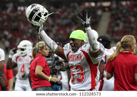 WARSAW, POLAND - SEPTEMBER 1: American football player, US team member Kesnel Menard (LB) screams to other team members during Euro-American Challenge match on September 1, 2012 in Warsaw, Poland.