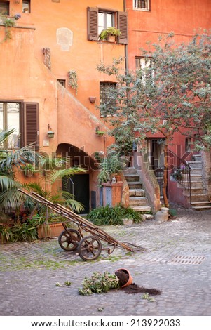 Traditional italian architecture. italian building. Italian view, traditional street in Italy. Roma. Traditional house in Italy. Back garden, entrance. Typical plant and flowers for Italian landscape