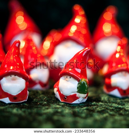 Small Santa clause statuette. Nobody. Christmas decorations selling during Christmas market. Background, postcard, Macro.