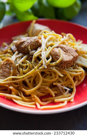 Chinese food. Chinese pasta, noodle with beef pieces with sayath sauce. Chinese restaurant, take away.