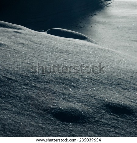 Snowdrift. Snow. Field covered by snow. Winter in forest. Nature in winter. Christmas postcard. Background. Macro perspective. Nobody. Outside. Burrow of snow.