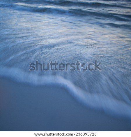 Mediterranean Sea coast. Waves are glancing off the coast. Sand seaside and sea. Holidays in Spain. Landscape view. NAture, wildlife. Summer.