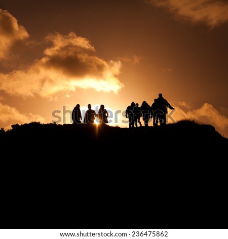 Group of people on a Scottish hill- Arthur Seat. Landscape view. Scottisch landscape. sunset, view, tourism, travelling, walking.