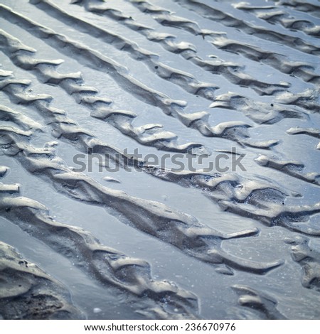 Sand beach. Paths on a sand after rising tide, high tide. Summer, holidays, Nature. Spain, Italy, Greece. Nobody, background.