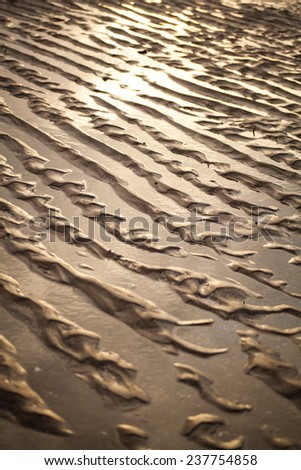 Sand beach. Paths on a sand after rising tide, high tide. Summer, holidays, Nature in Scotland. Nobody, background.