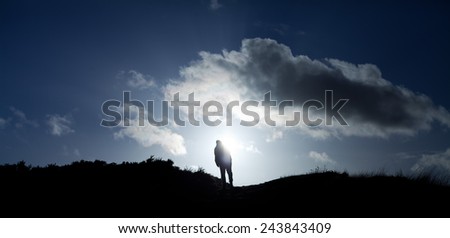 Man on a Scottish hill- Arthur Seat. Landscape view. Scottisch landscape. sunset, view, tourism, traveling, walking.