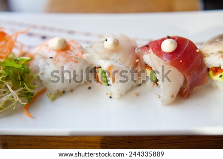 Sushi prepared with rice, raw tuna, raw salomon, wahhabi sauce, majo, soya sauce, prawn and avocado. You can find it at japanese restaurant. Japan, japanese food, Asia