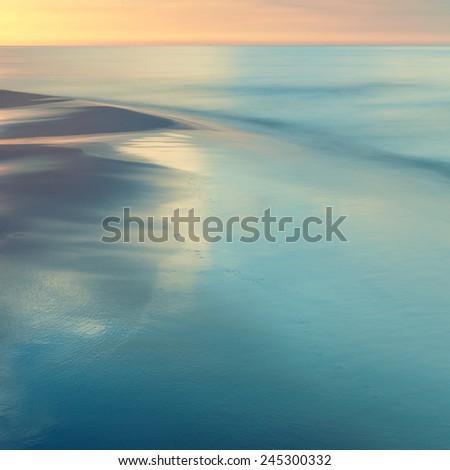 Mediterranean Sea coast during sunset. Sand seaside and sea. Holidays in Spain. Landscape view. NAture, wildlife. Summer.