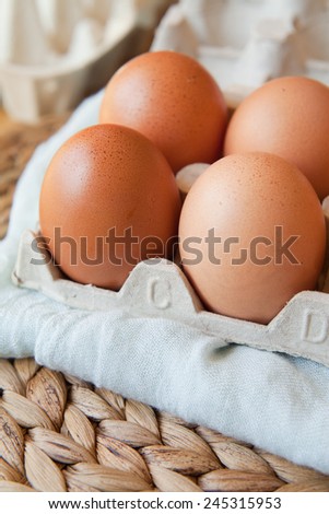 Eggs placed on a blue towel put on a wattle place mat. MAcro perspective, nobody, background, food. Easter, home-made food.