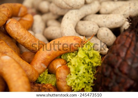 Home-made smoked and white  sausages and smoked ham prepared by polish butcher Sell in fair, markets or butchery shops. Nobody, healthy, organic food. meet with herbs and spices.