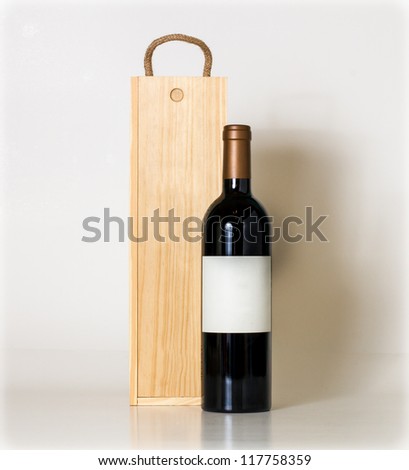 Bottle of wine and wooden box.