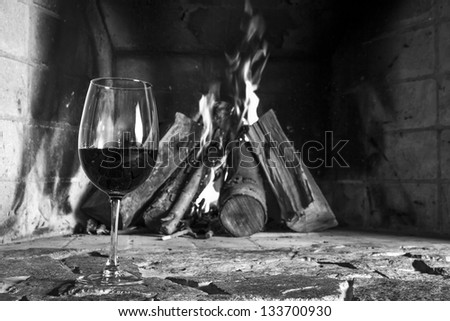 Wine cup and fire place on the background.