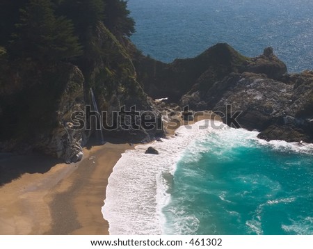 The delicate McCoy Falls pour off the mountain straight into the Pacific Ocean in this beautiful cove