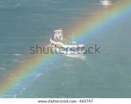 Boat crossing rainbow at Niagara Falls, Canada