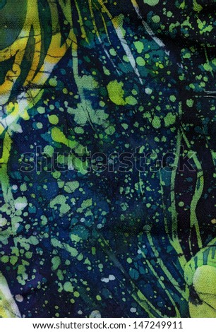 Abstract pattern on silk batik Hand-coloring silk with a fantastic ornament. Splash effect.