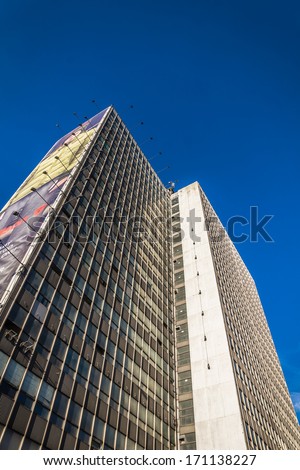 KATOWICE, POLAND - JANUARY 11, 2014: Office building of former local railway authorities, sold to new investors, awaiting general repairs and development. In the meantime used as an advertising space.