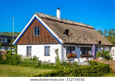 KASEBERGA, SWEDEN - AUGUST 14, 2014: Colorful house in  Kaseberga, Sweden. Kaseberga is a small fishing village near Ystad,  well-known for Ales Stenar mysterious stone circle created 1400 years ago.