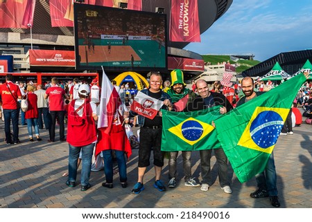 KATOWICE, POLAND - SEPTEMBER 20, 2014: Polish and Brazilian fans watch Brazil vs France match on the screen in the fanzone at Spodek Arena during FIVB Volleyball Men\'s World Championship Poland 2014.