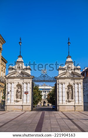WARSAW, POLAND - SEPTEMBER 13, 2014: Neo-Baroque gate to the University of Warsaw, the largest academy in Poland established in 1816, offering 37 different fields of study and over 100 specializations
