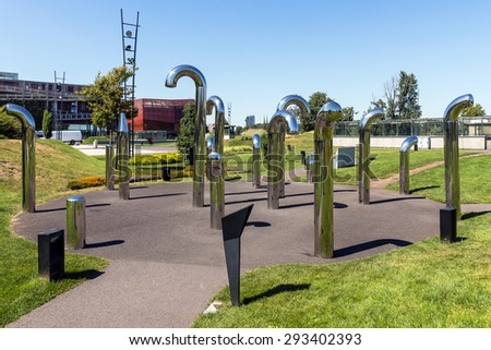 WARSAW, POLAND - JULY 3, 2015: Permanent interactive audio installation in Discovery Park next to  Copernicus Science Centre. The tubes are equipped with the system producing natural sounds.