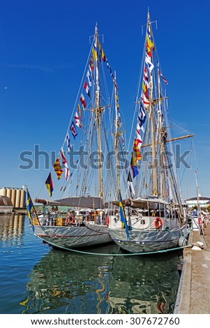 YSTAD, SWEDEN - AUGUST 6, 2015: Sailing boats moored in the Port of Ystad during Nordic Cadet Meeting (NOCA), annual event arranged by naval warfare academies of Sweden, Norway, Denmark and Finland.
