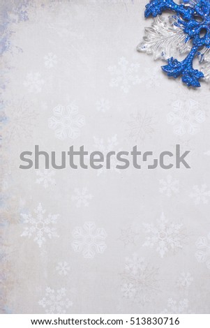 Beautiful paper background with delicate color and pattern of snowflakes.