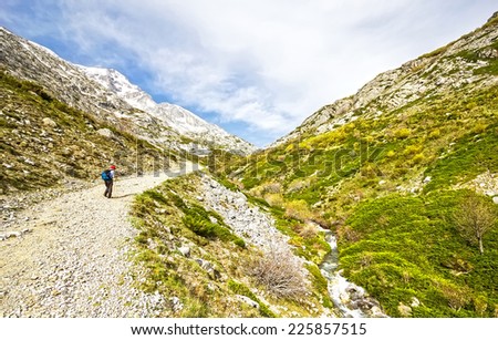A old man walking near of the Espiguete peak in the mountains of Palencia, Castilla-Leon, Spain