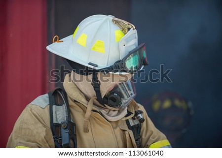 Single firefighter leaving a building