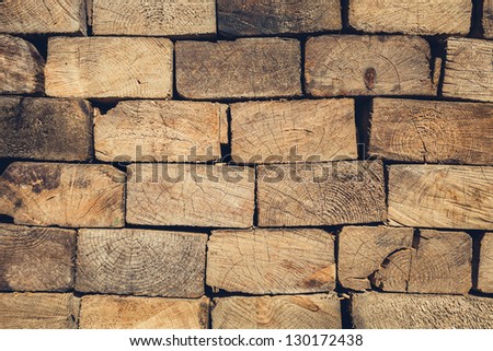 Background of Stacked Wood Cut in   Squared Timber