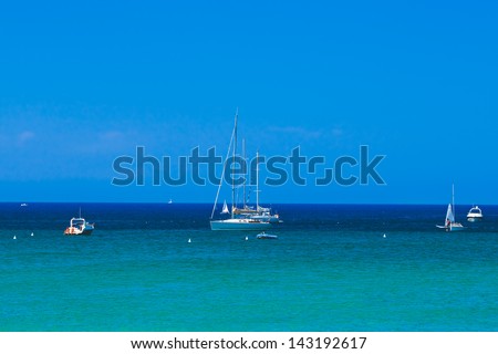 Yachts Anchored by the Beach in the Mediterranean Sea
