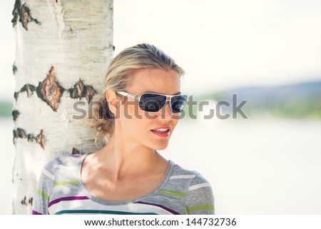 Beautiful Girl Wearing Sunglasses Is Looking Forward