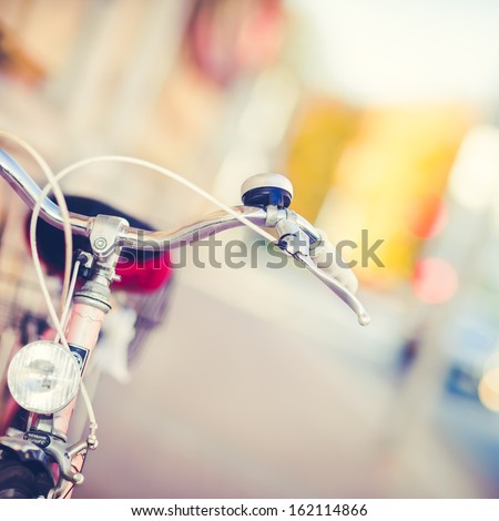 Detail of a Vintage Bike HandleBar with a Colorful Background Bokeh