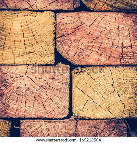 Background of Colorful Stacked Wood Cut in Squared Timber