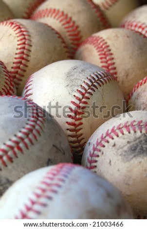 Close up with depth of field of old baseballs close together