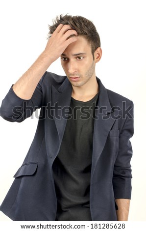 Young beautiful businessman stressed at work, overworking