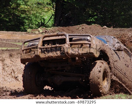 Off road vehicle coming out of a mud hole hazard