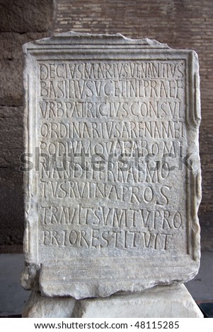 Engraved stone in Coliseum with latin letters