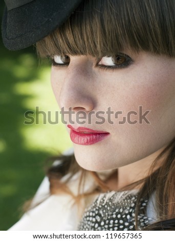 beautiful girl with a small black hat profile