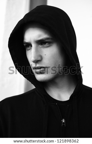 handsome young man with a black hood