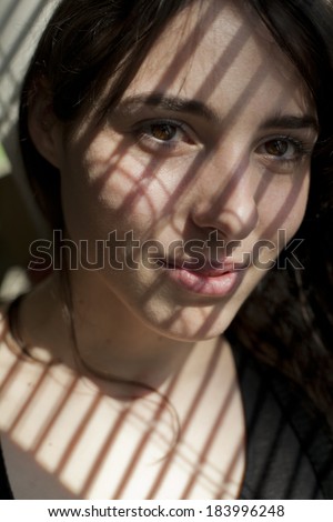 girl with shadow stripes over her face