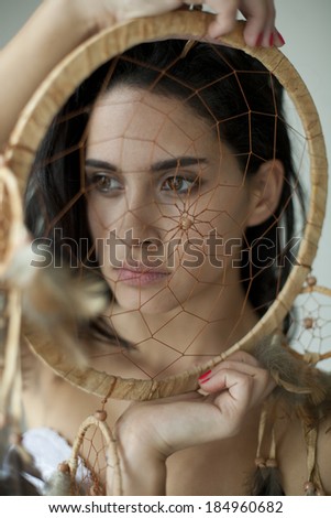 woman with a dream catcher , girl in traditional Indian wear and dream catcher posing to the camera ,