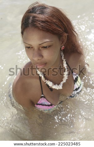 http://image.shutterstock.com/display_pic_with_logo/1180193/225023485/stock-photo-beautiful-latin-girl-dressed-in-bikini-at-the-beach-posing-in-the-water-fashion-photo-of-sensual-225023485.jpg