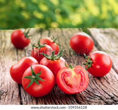 Tomatoes, Cooked With Herbs For The Preservation On The Old Wooden Table.