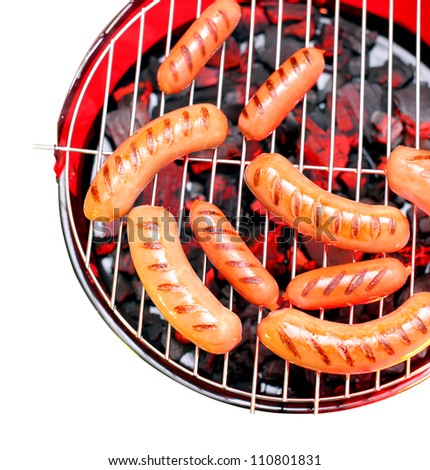 Sausages on a grill. File contains the path to cut.
